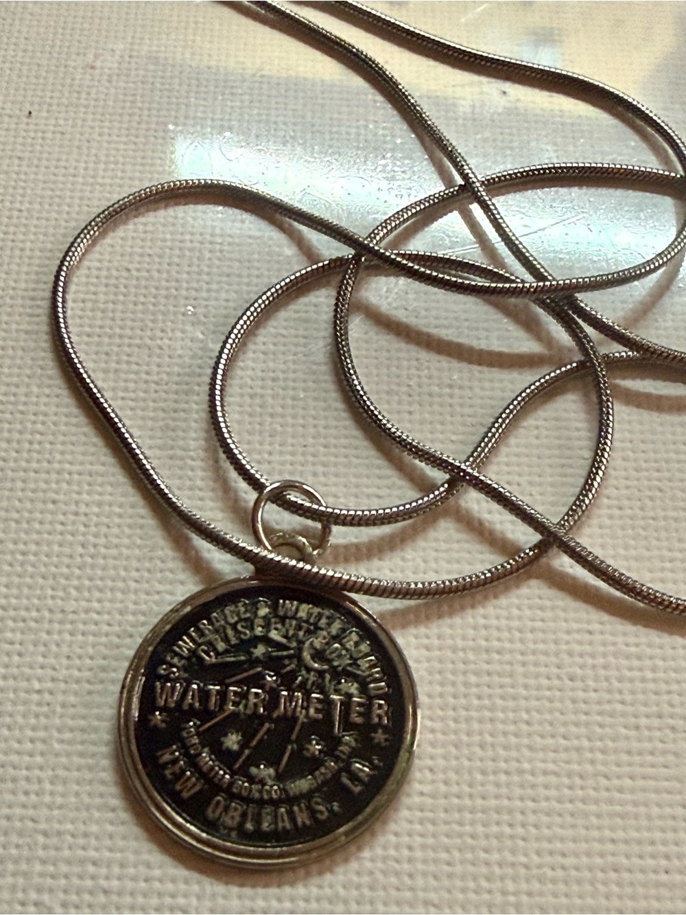 Vintage Water New Orleans Meter Pendant Necklace in Silver with wear